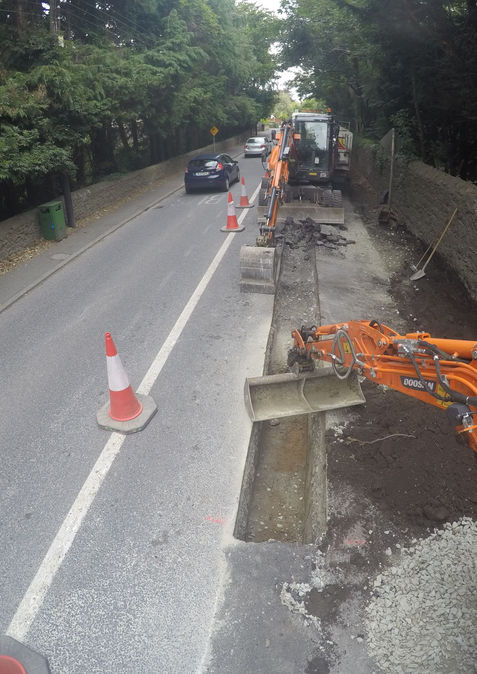 Road resurfacing works in progress with traffic management, Formac Construction paving contractors Leinster