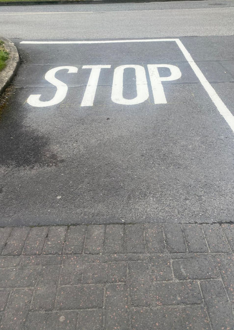 Road marking and stop line on newly laid bituminous surface, Formac Construction civil works Leinster