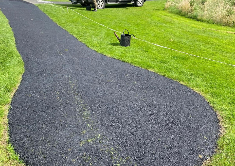 Newly laid bituminous driveway path through landscaped grounds, Formac Construction Leinster