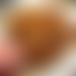 hand holding a homemade sweet potato hash brown fritter