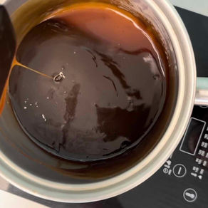 sauce pot of vegan coconut milk caramel sauce