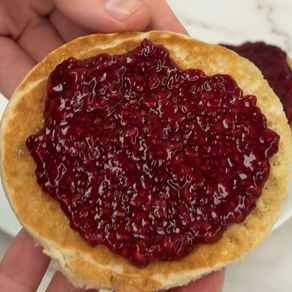 gluten free crumpet slathered in raspberry chia jam