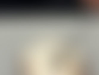 single serve cinnamon roll with a fork coming in for a bite