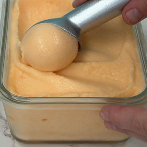 scooping homemade caneloupe sorbet