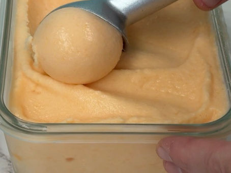 scooping homemade caneloupe sorbet
