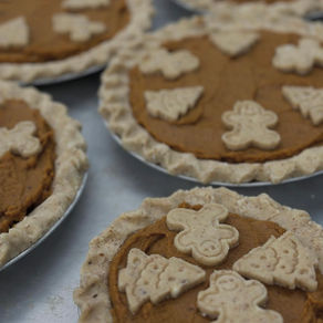 pumpkin pies with cutout gingerbread decorations