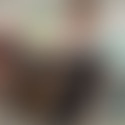 holding a layered chocolate mousse "dirt" "flower pot" cup