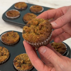 holding a banana chocolate chip gluten free muffin
