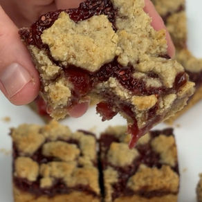 strawberry jam crumble bar with a bite missing