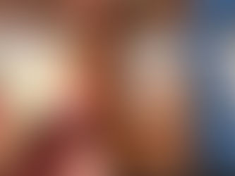 hand holding a square shaped marshmallow in front of max mallow keto sugar free marshmallow packages