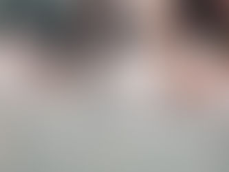 overview of two bakers shaping gluten free pretzels on a stainless steel table