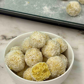 bowl of coconut coated lemon bliss energy balls