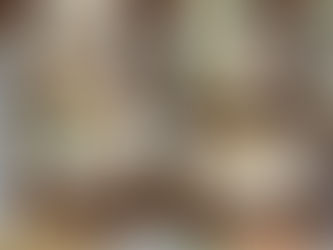 tray of carrot cake cookies decorated with an icing carrot or chopped pecans