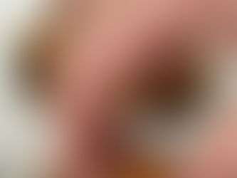 a bowl full of timbit sized homemade churro spiced donut holes dusted with cinnamon sugar