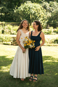 Bride & Mother standing in beautiful garden at a summer new hampshire wedding