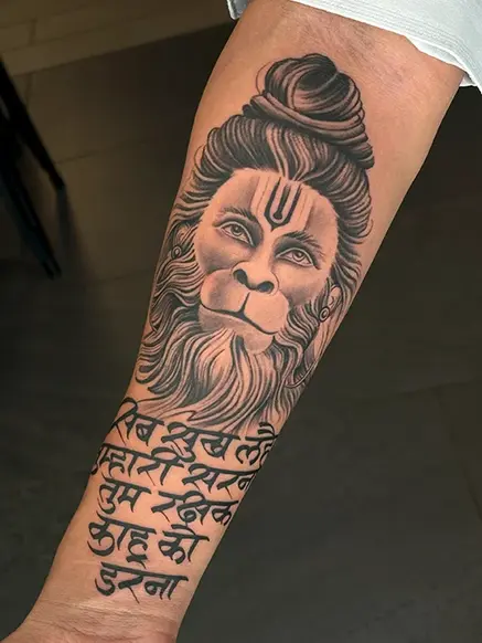 hanuman and script tattoo