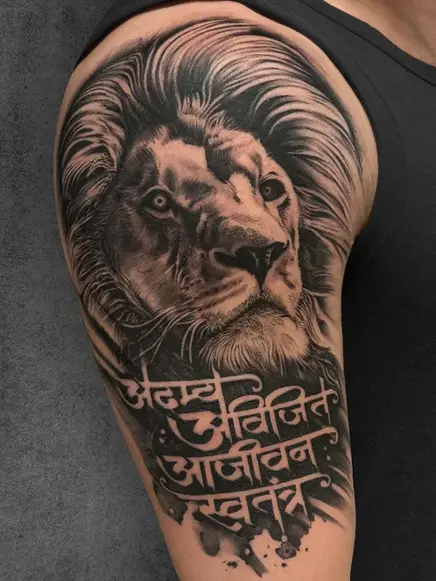 lion face portrait and script tattoo