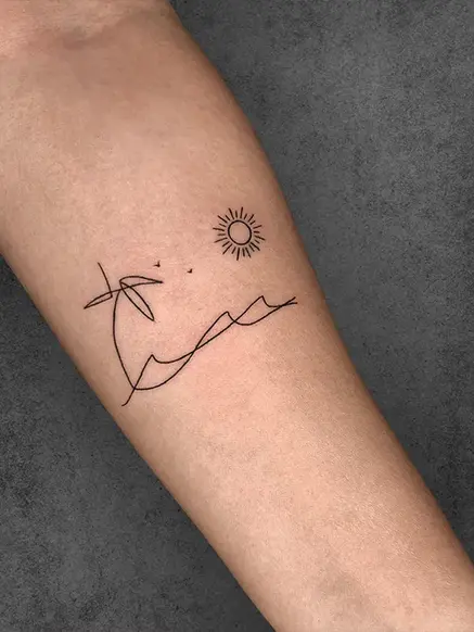 minimalist sun tattoo