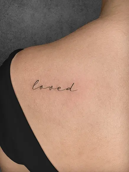 loved script tattoo