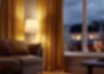 A cozy living room corner with a floor lamp glowing beside yellow curtains at dusk.