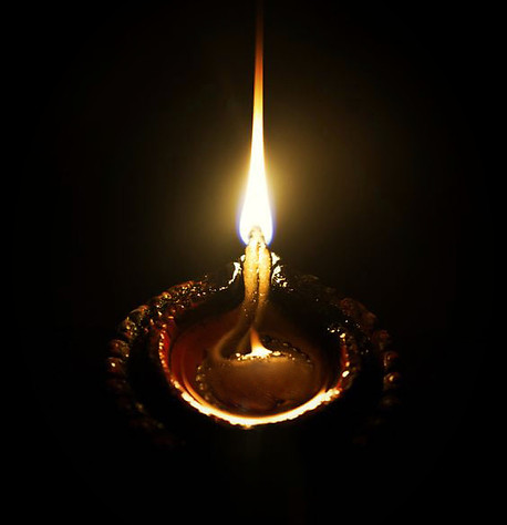 Glowing oil lamp symbolizing inner light and sacred presence.