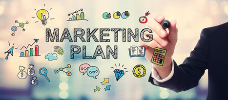 Business hand drawing MARKETING PLAN with colorful strategy doodles, charts, money, and icons on a blurred office background.