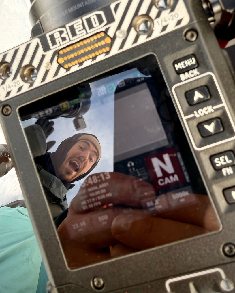 Marcus Ahlström seen through the reflection of a RED Komodo-X camera.