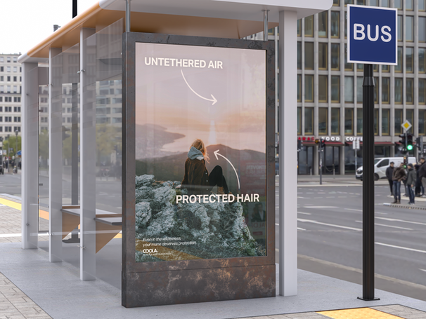 Bus stop advertisement with a woman with blonde hair overlooking landscape