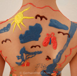 "Garden" — an original drawing by a young girl, recreated in chocolate on her back.