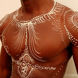 "Omar – The Warrior" — sculptural body art created with white chocolate.