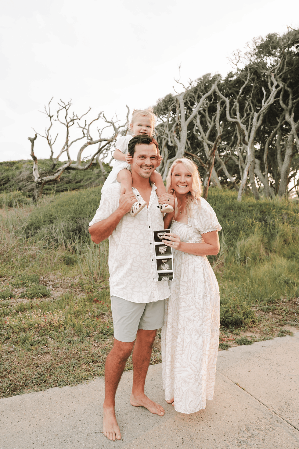 Trey and Landyn Lewis with their daughter, the family behind Lewis Coastal Homes.