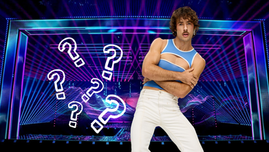 Go-Jo with the Basel Eurovision 2025 stage as a backdrop with question marks floating next to Go-Jo