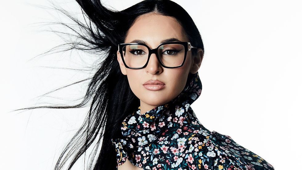 Klavdia in a multi-coloured floral outfit