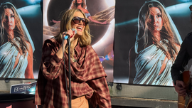 Delta performing at her pop up show in Camden