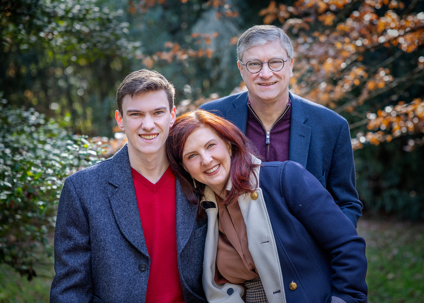 family photograph of mom, dad, and one son 