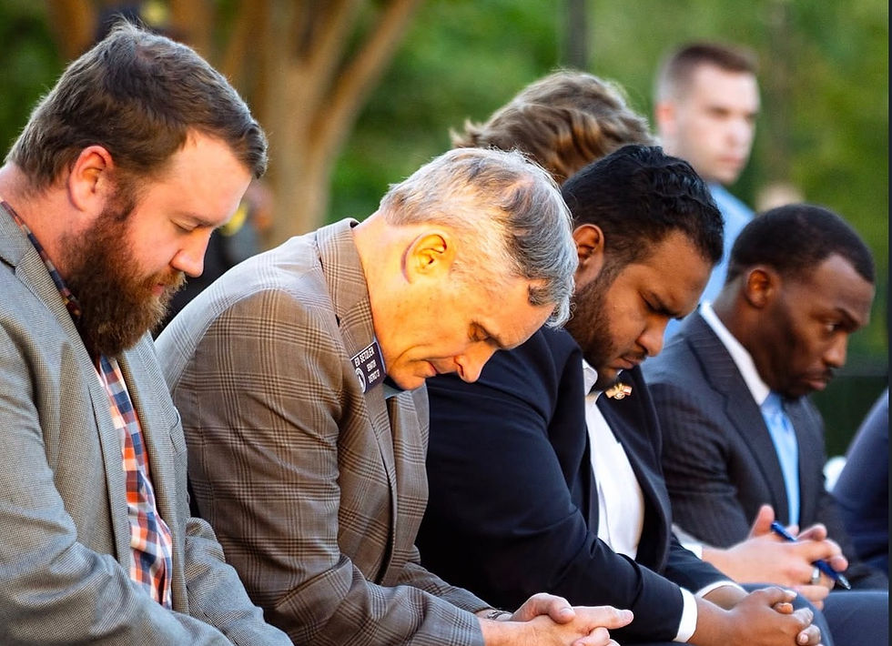 From left to right: State Rep. Jordan Ridley, State Sen. Ed Setzler, and Georgia Young Republicans Treasurer Emanuel Hernaiz during a moment of prayer. (CP Vendryes)