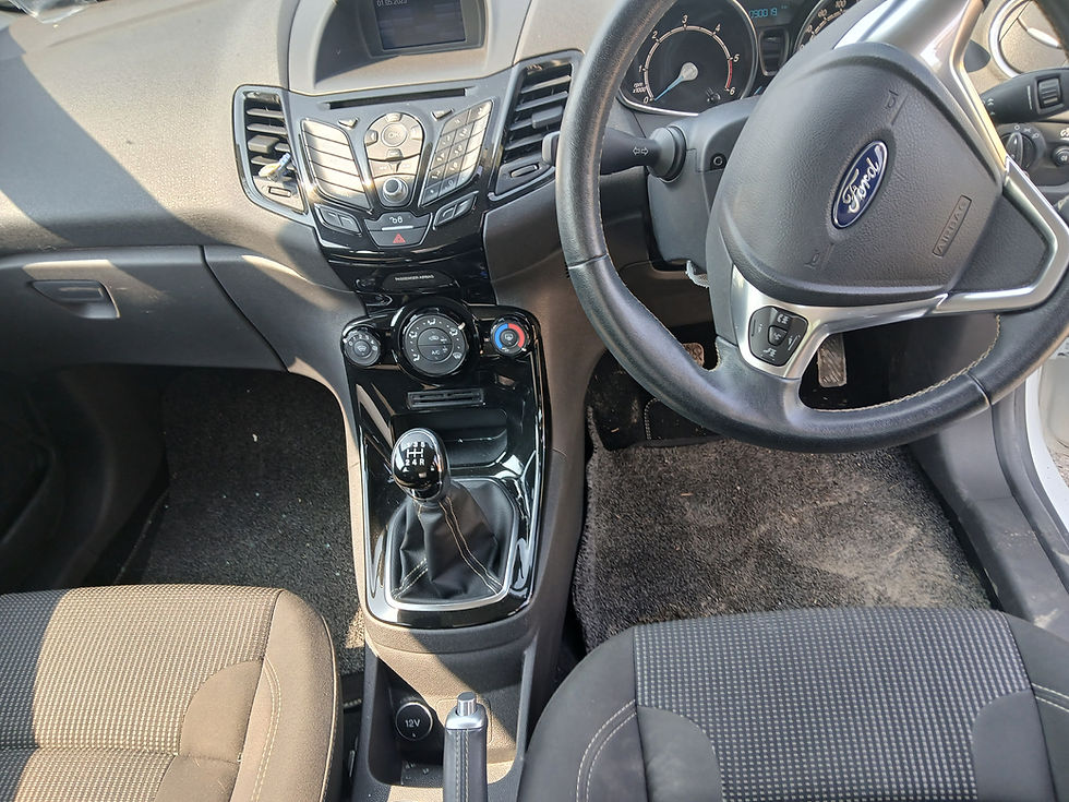 Thumbnail: Ford Fiesta interior: beige seats, gear stick, steering wheel