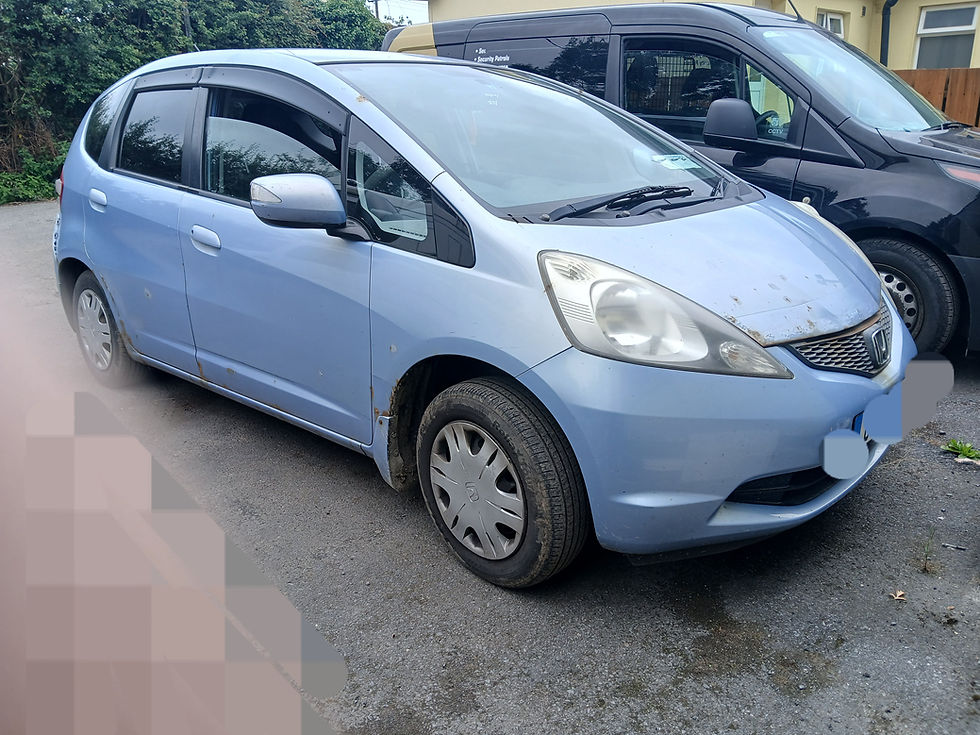Light blue Honda Fit, available at Doolin Dismantlers
