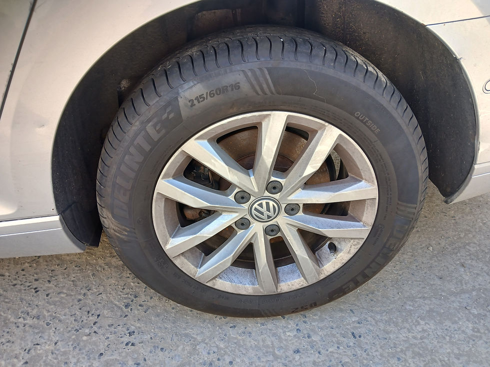 Thumbnail: Silver VW alloy wheel with tire