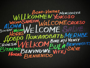 A word cloud made of the word "Welcome" in many different languages.