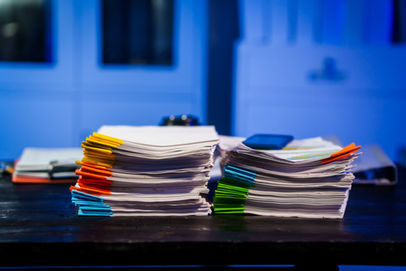 Stacks of file folders on a desk