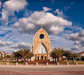 Church surrounded by modern buildings in Ave Maria Florida_edited_edited_edited.jpg
