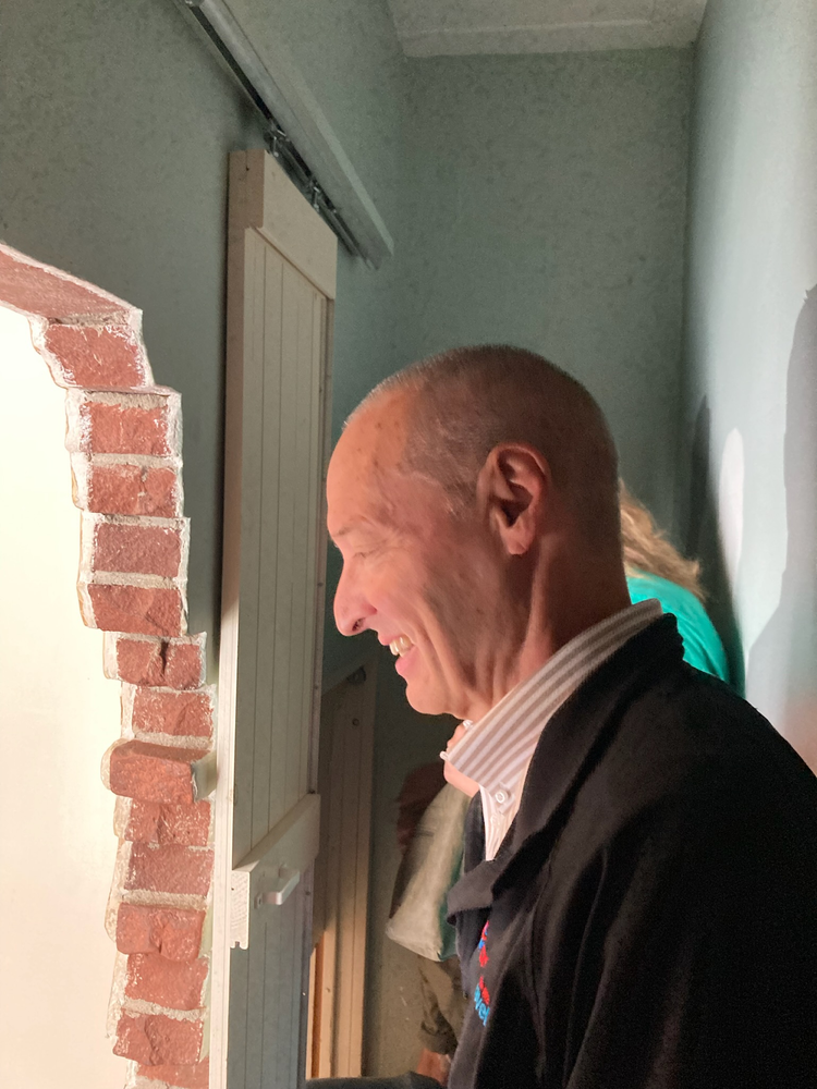 Lance standing inside the hiding place at Corrie Ten Boom's house in Haarlem, Netherlands. Lance Chima standing inside the hiding place at Corrie Ten Boom's house in Haarlem, Netherlands.