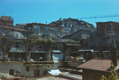 Urban rooftops and houses photographed on analog film