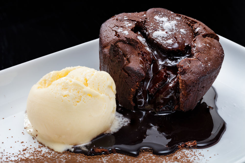 Indulge in decadence with our Chocolate Lava Cake, a dessert sensation that will melt your heart with every irresistible bite! Delight in the warm, gooey center of rich, velvety chocolate, encased in a moist and fluffy cake exterior. As you cut through the delicate shell, a river of molten chocolate flows forth, creating a symphony of flavor and texture that is simply divine. 
