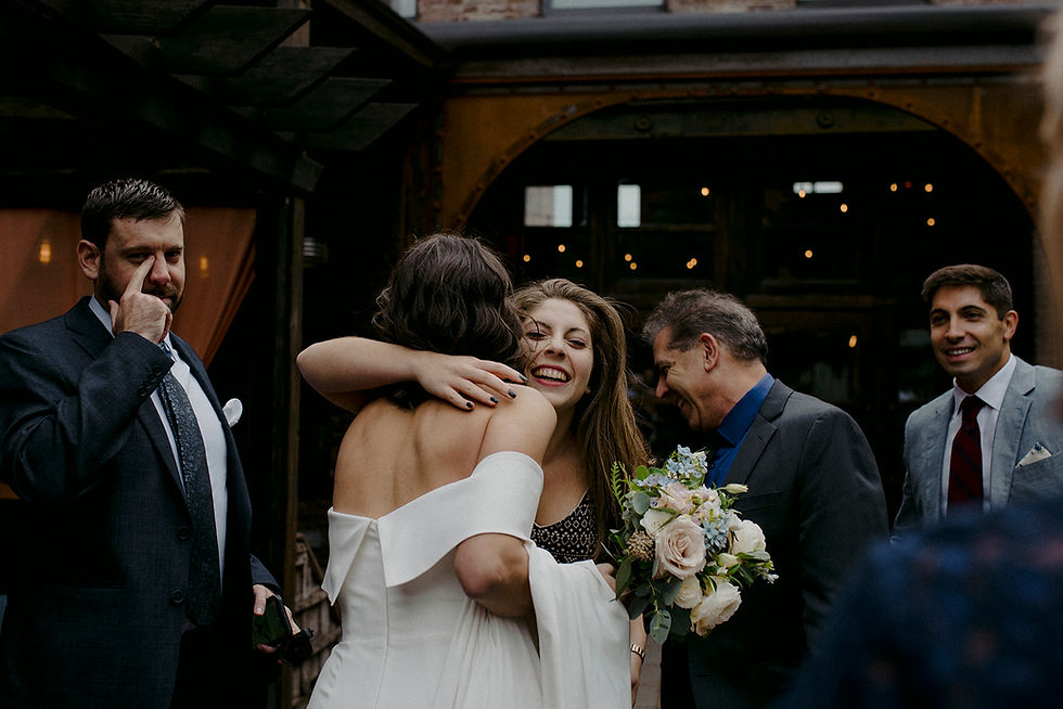 Guests gather in the courtyard and congratulate the bride after a ceremony