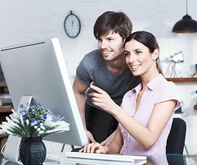 Business owners looking computer
