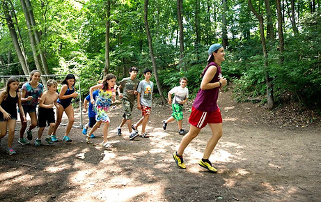 kids in the woods doing soccer drills