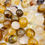 Miniature : Quartz guérisseur doré Étoilé | pierre roulée