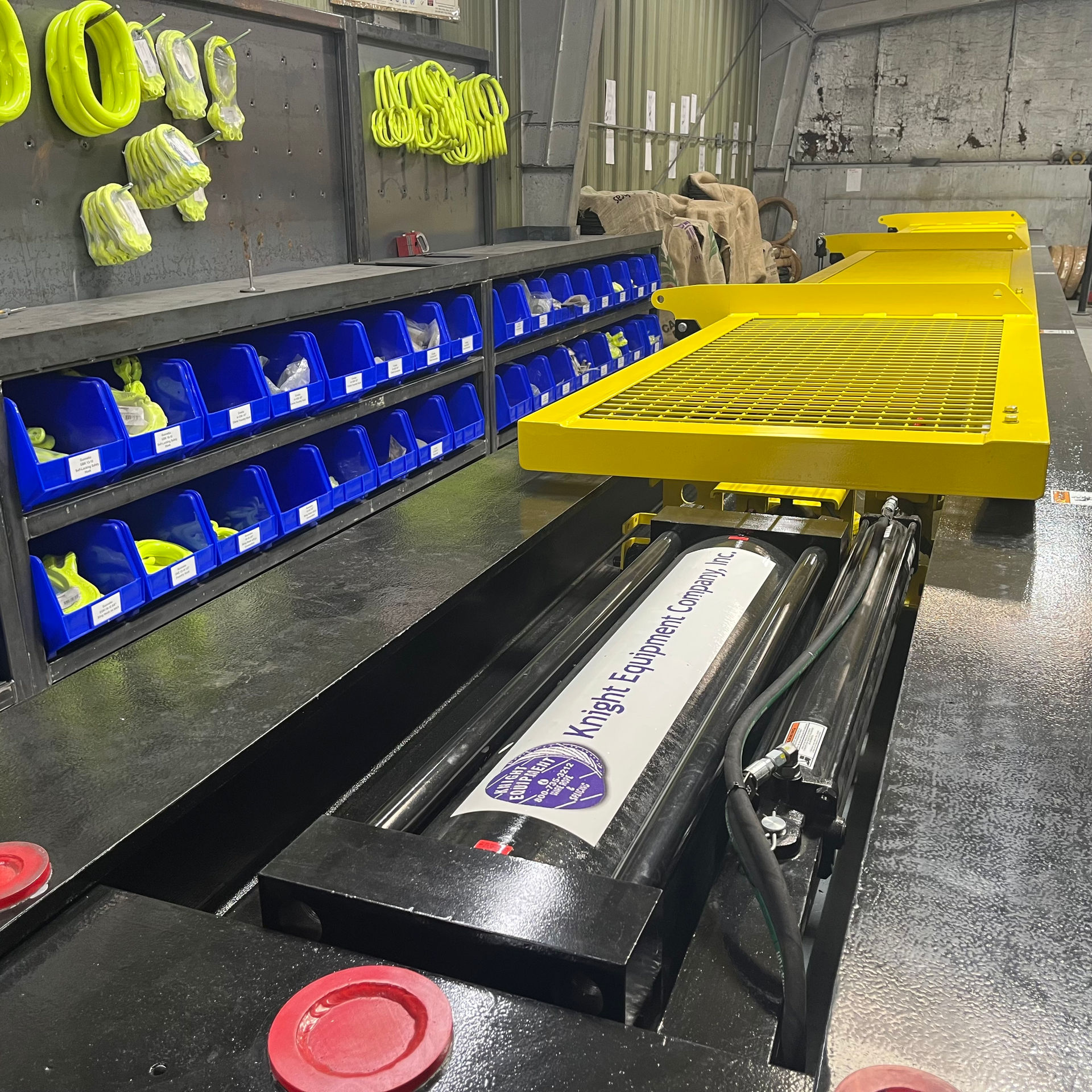 Chant testbed with the protective caging closed. The subject of the photo is a large hydraulic ram that is used to pull the subject to double the working load.